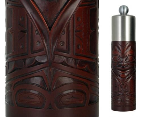 Red-brown recycled glass grinder with West Coast First Nations chieftain design.