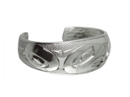 Wide silver bracelet, etched with a West Coast First Nations abstract design.