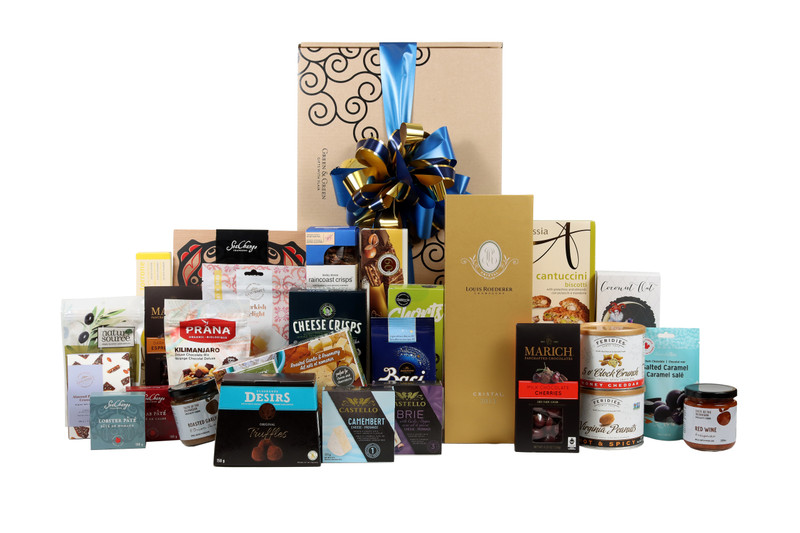 Gourmet gift box featuring  Louis Roederer Cristal brut Champagne paired with sweet and savoury snacks (chocolate, crackers, nuts, etc.), packaged in signature Green & Green gift box with ribbon and bow.