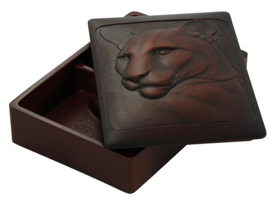 Recycled glass box carved with cougar design.