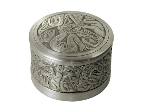 Round pewter box with West Coast First Nations' raven and sun design.