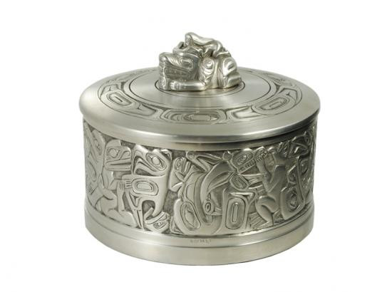 Round pewter box with West Coast First Nations' woman and bear design and pewter lid ornament.