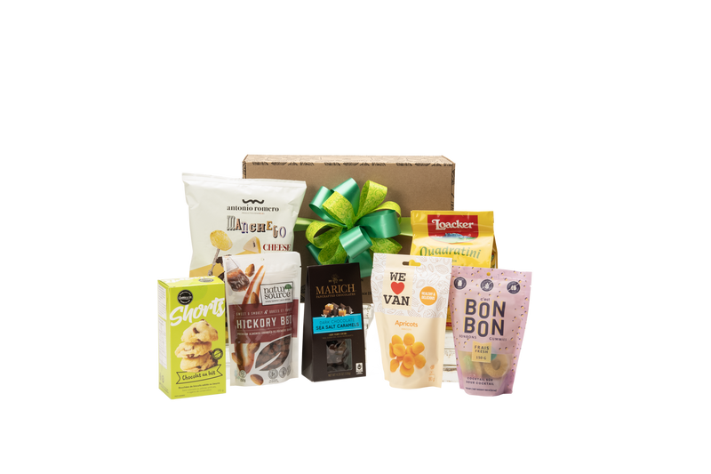 Gourmet gift basket featuring sweet and savoury snacks (chocolate, cookies, crackers, nuts, etc.) packaged in signature Green & Green gift box with ribbon and bow.