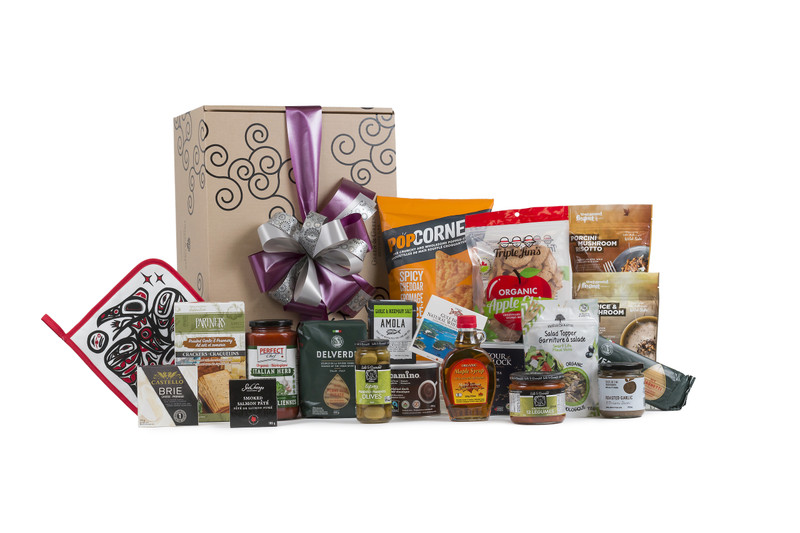 Selection of pantry staples from meals to snacks, sweet and savory items wrapped in Green & Green signature gift box.