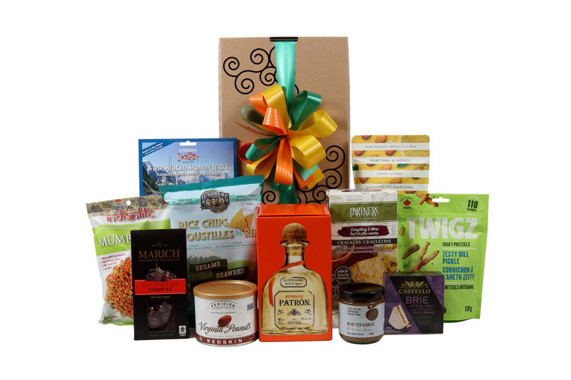 Gourmet gift basket featuring  Patrón Reposado Tequila paired with sweet and savoury snacks (chocolate, crackers, nuts, etc.), packaged in signature Green & Green gift box with ribbon and bow.