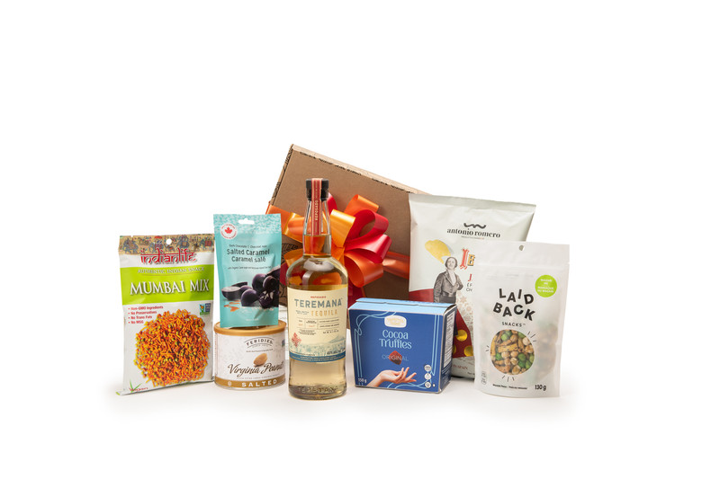 Gourmet tequila gift box featuring Teremana Reposado Tequila paired with sweet and savoury snacks (chocolate, crackers, nuts, etc.), packaged in signature Green & Green gift box with ribbon and bow.