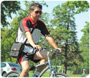 Photo of a man riding a bicycle and using the FreeStyle