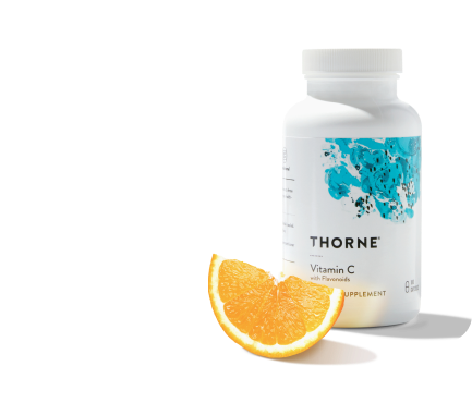 immune support Thorne bottle with orange next to bottle