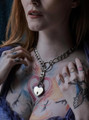 Close-up of model wearing the collar with heart lock pendant