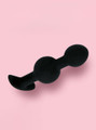 Black silicone double-bulb anal trainer with smooth rounded shape and curved anchor base