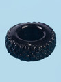 Close-up of black TPE Tire Ring cock ring with chunky raised tread pattern.