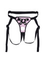 Flat lay of Pink faux leather strap-on harness with front opening, strap details and black trim.