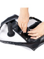 Close-up of the detachable inner panel and removable black silicone dildo inside the faux leather thong.