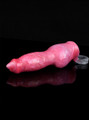 Red marbled canine breeder penis sleeve lying horizontally with pointed fantasy tip and grey ball loop