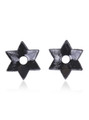 Adhesive backing of black star-shaped open nipple pasties.
