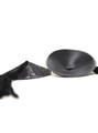 Side view of black sparkling nipple pasties showing the 2 cm (0.8 in) domed shape and self-adhesive backing.