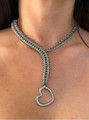 Silver heart lariat chain necklace worn on bare skin