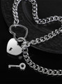 Silver heart padlock collar with key close-up