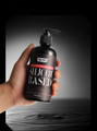 Silicone-based pleasure lubricant 300 mL (10 fl oz) bottle held in hand