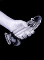 Clear realistic dildo with balls and suction cup held in hand