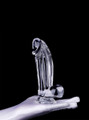 Clear realistic dildo with pronounced head, balls and suction base standing upright