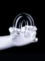 Clear flexible straight dildo bent into a U shape to demonstrate flexibility