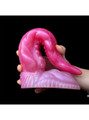Large fantasy tentacle dildo folded into a deep curve to show flexibility