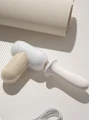 White and cream rechargeable thrusting sex toy with removable silicone insert and USB-C charging cable