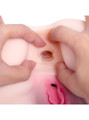 Close-up of the textured inside of Bambi’s anal hole with her pink pussy visible below
