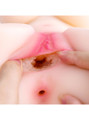 Close-up of the rounded gripping texture inside Brielle's vaginal hole with her anal entrance visible below