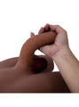 Flexible 19 cm (7.5 in) TPE penis on tan ladyboy torso doll bending by hand
