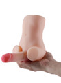 Light skin tone mini male sex doll held in hand with 9 cm (3.5 in) cock