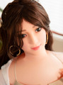 Coco inflatable sex doll with dark brown hair and realistic face close-up