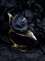 Luxurious gold leaf candle holder with a rose candle, combining classic beauty with sensual warmth.