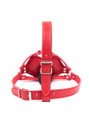 Detailed view of the harness and mouth-shaped gag in red vegan leather