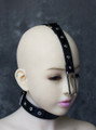 Overhead view of the Leather and Metal Nose Hook Restraint, displaying the adjustable leather straps and metal components.