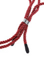 Close-up of red bondage rope collar with metal clasp