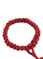 Detailed view of the woven red rope collar