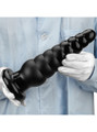 Person holding the ribbed PVC anal plug, showing its massive size.