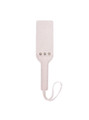 Beige leather BDSM paddle placed flat, highlighting its sleek and durable design.