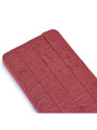 Close-up of the hand-distressed red leather surface highlighting its unique texture.