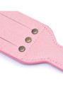 Pink BDSM paddle highlighting the ergonomic handle and charming design.