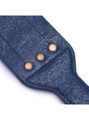 Close-up of the textured navy leather surface with metallic rivet details.