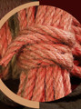 Close-up of a single jute rope coil, emphasizing the smooth and consistent weave.