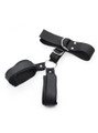 Wrist cuffs fastened tightly, showing restraint functionality