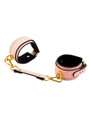Elegant pink PU leather bondage cuffs with gold-tone hardware.