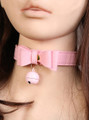 A pink faux leather choker with a bow and jingling bell.