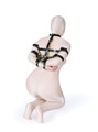 Model kneeling in full bondage position wearing collar-to-arm restraint