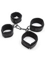 Close-up of padded cuffs with metal hardware