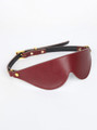 Red leather eye mask with gold buckle strap